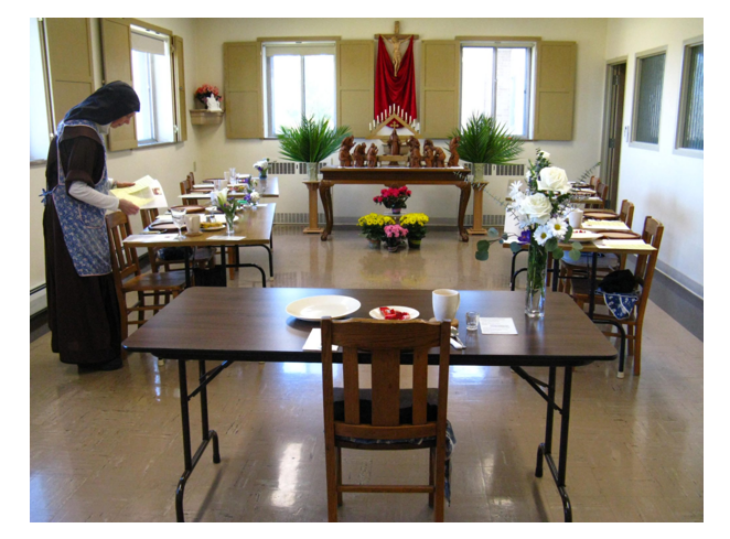 Sr Mary Agnes setting the refectory